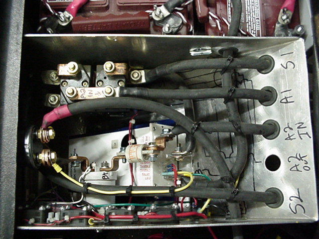 Close up of the drive control box - Axe controller, F&R relay, Drive relay, fuse, cooling fans, disconnect switch