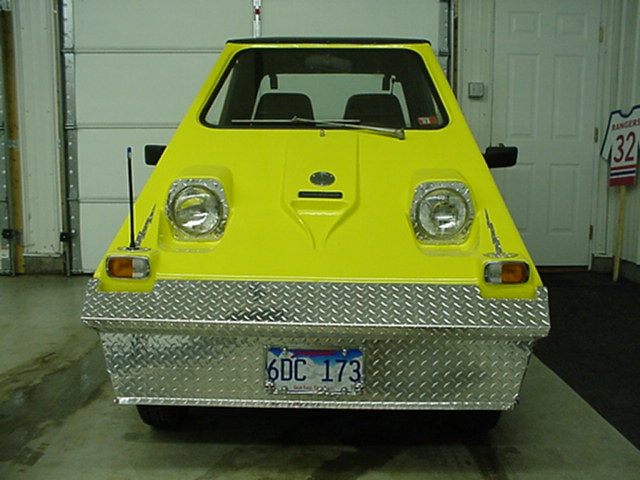 View of the front, the 'gas' cap has the charger plug in under it