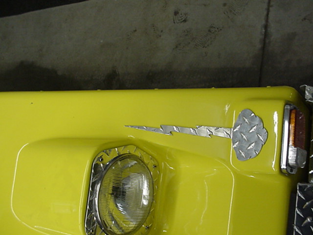 Cloud and lightning decoration above the headlights