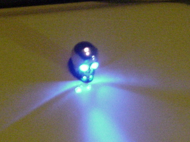 The windshield washer sprayer skull happens to have blue lit eyes