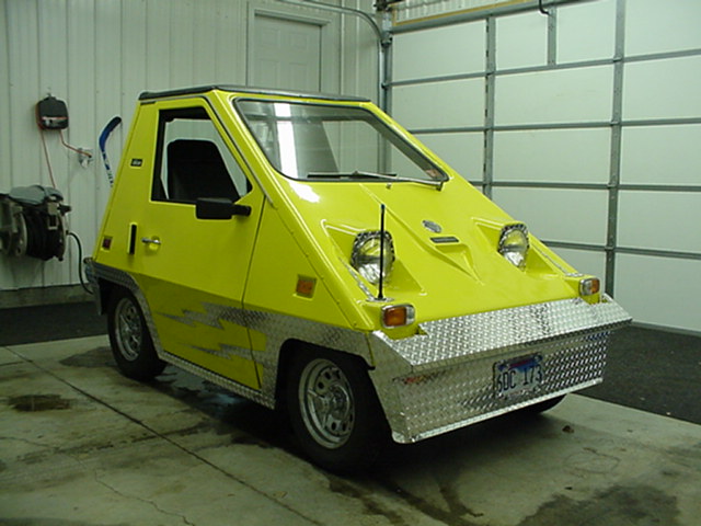 View of the passenger corner, the diamond plate bumper swings up to get at front axle